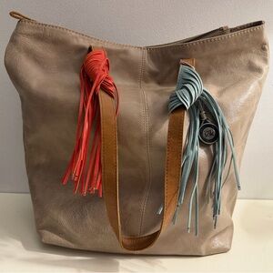 The sak beige leather bohemian tote.